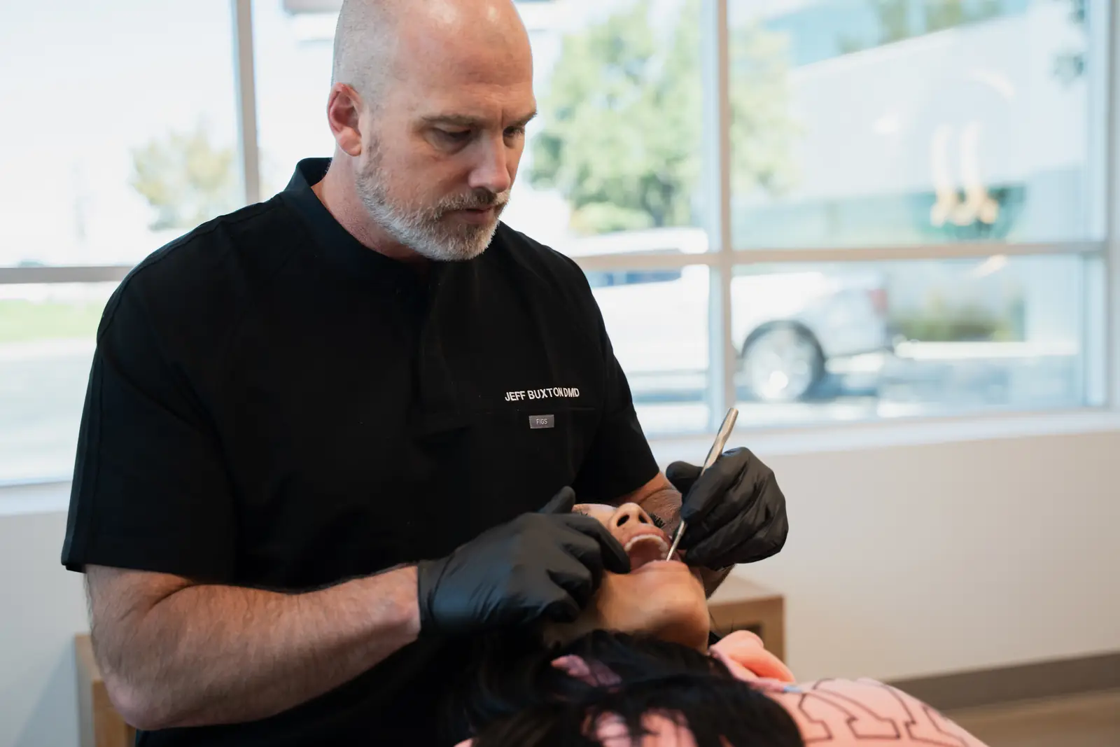 Dr. Jeff Buxton examining an adult patient at Toothpillow Breathing and Sleep Center in Draper, Utah